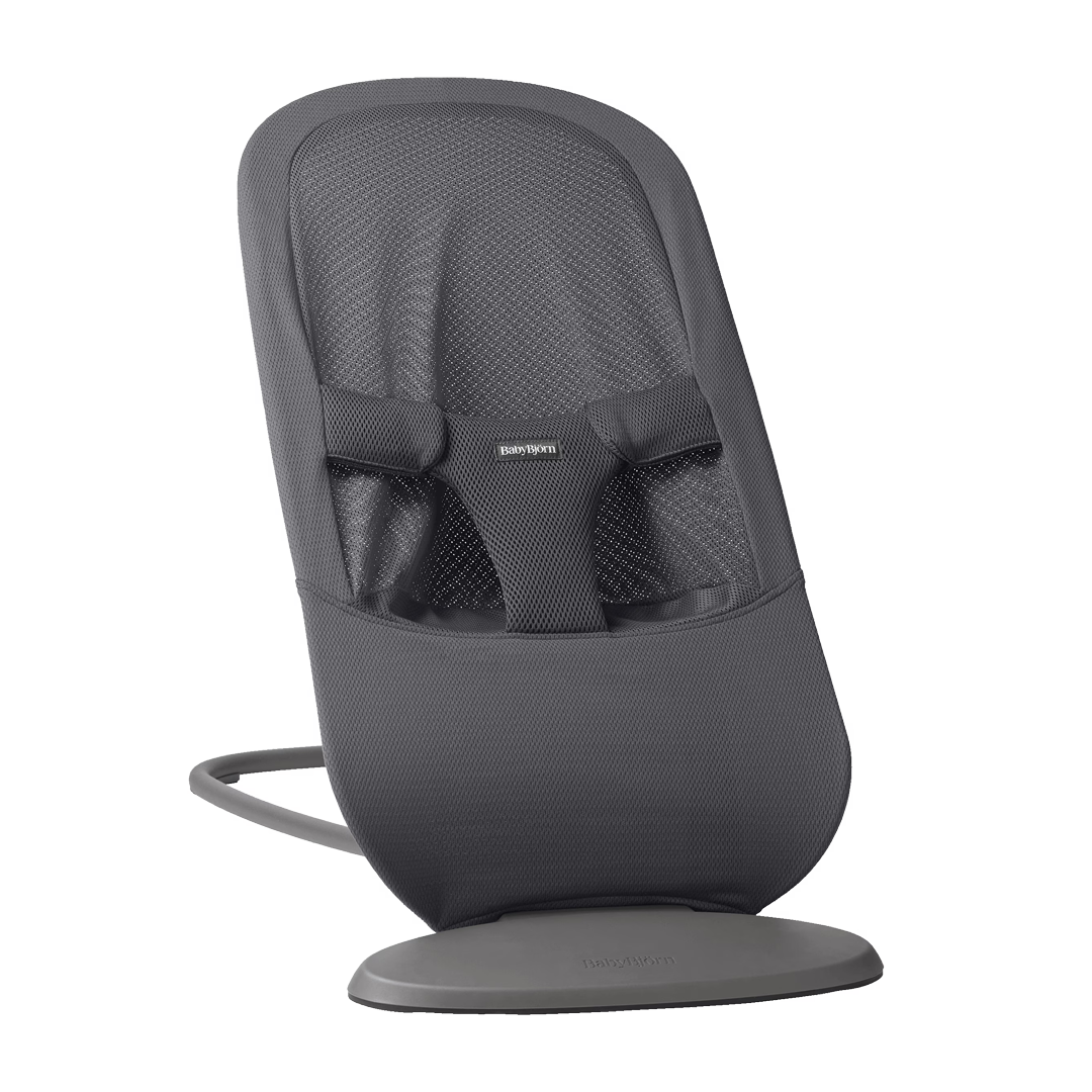 A gray mesh baby bouncer with a sleek design, featuring a sturdy base and adjustable harness.