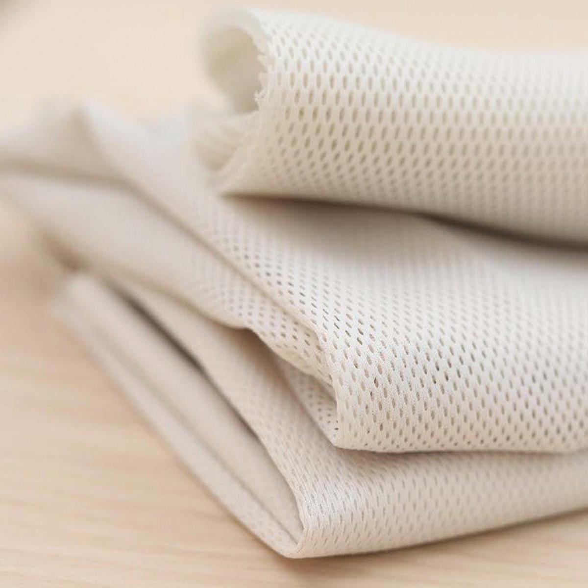 Airy mesh fabric in cream colour from BabyBjörn