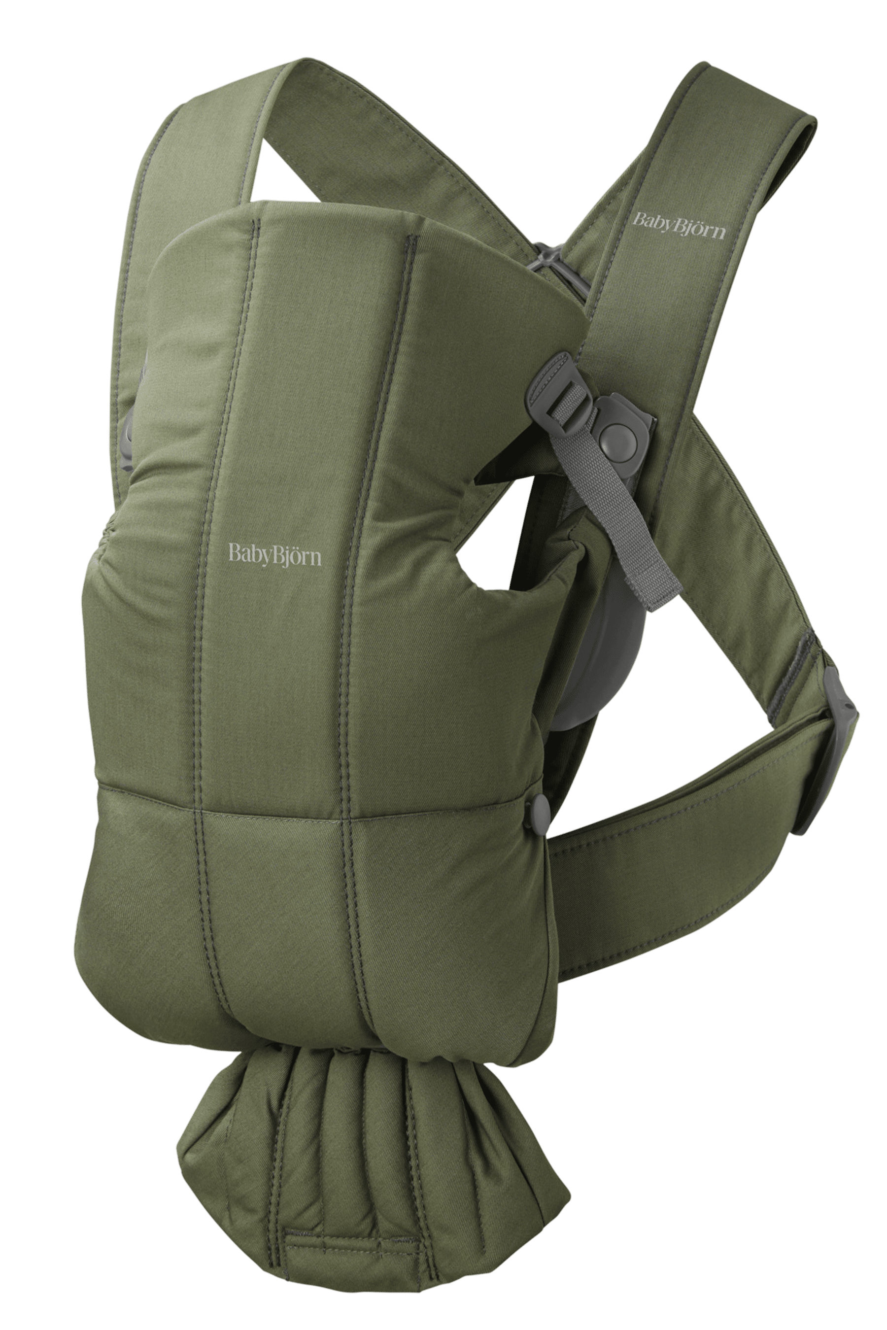 Green BabyBjörn baby carrier with padded straps and adjustable buckles, designed for comfort and support.